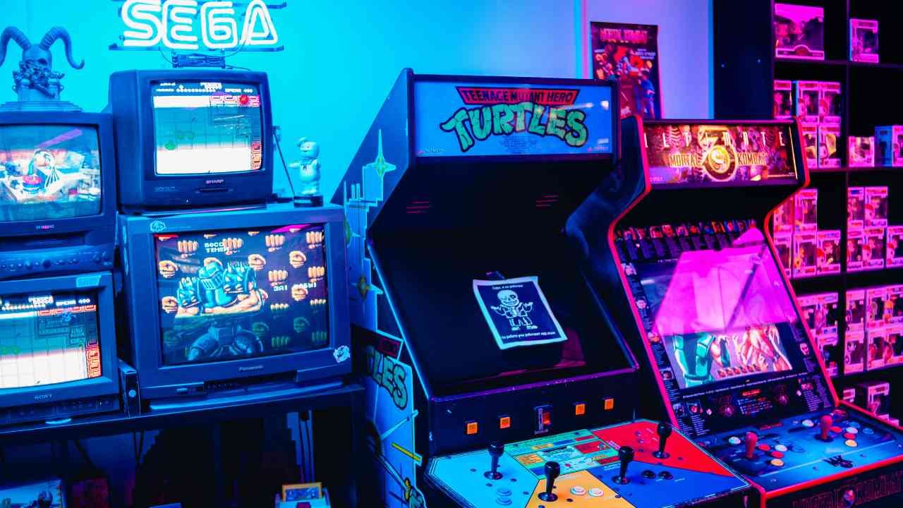 Classic arcade machine in a home setting with joystick and vintage game on screen